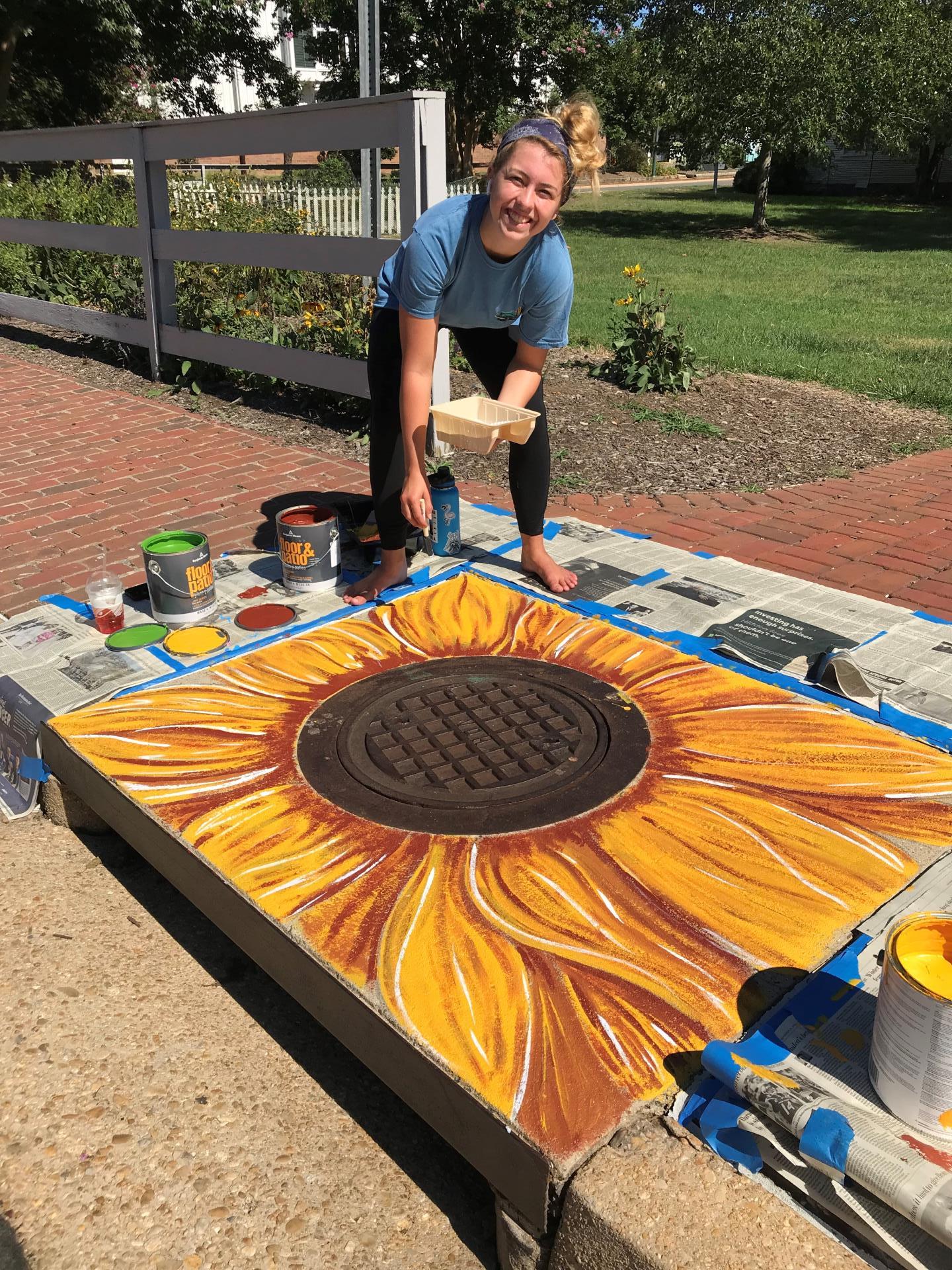 public art around manhole cover